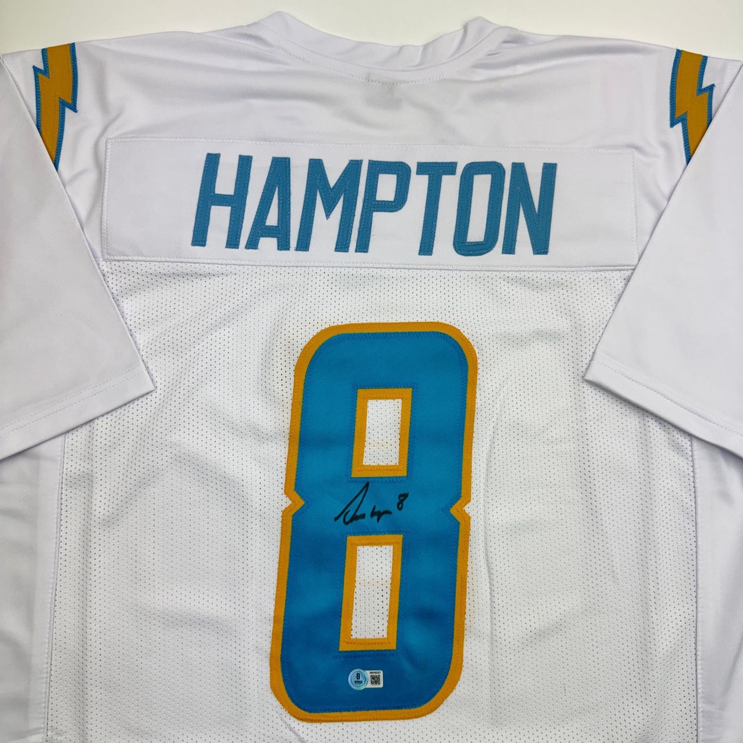 Autographed/Signed Omarion Hampton Los Angeles San Diego White Football Jersey Beckett BAS COA