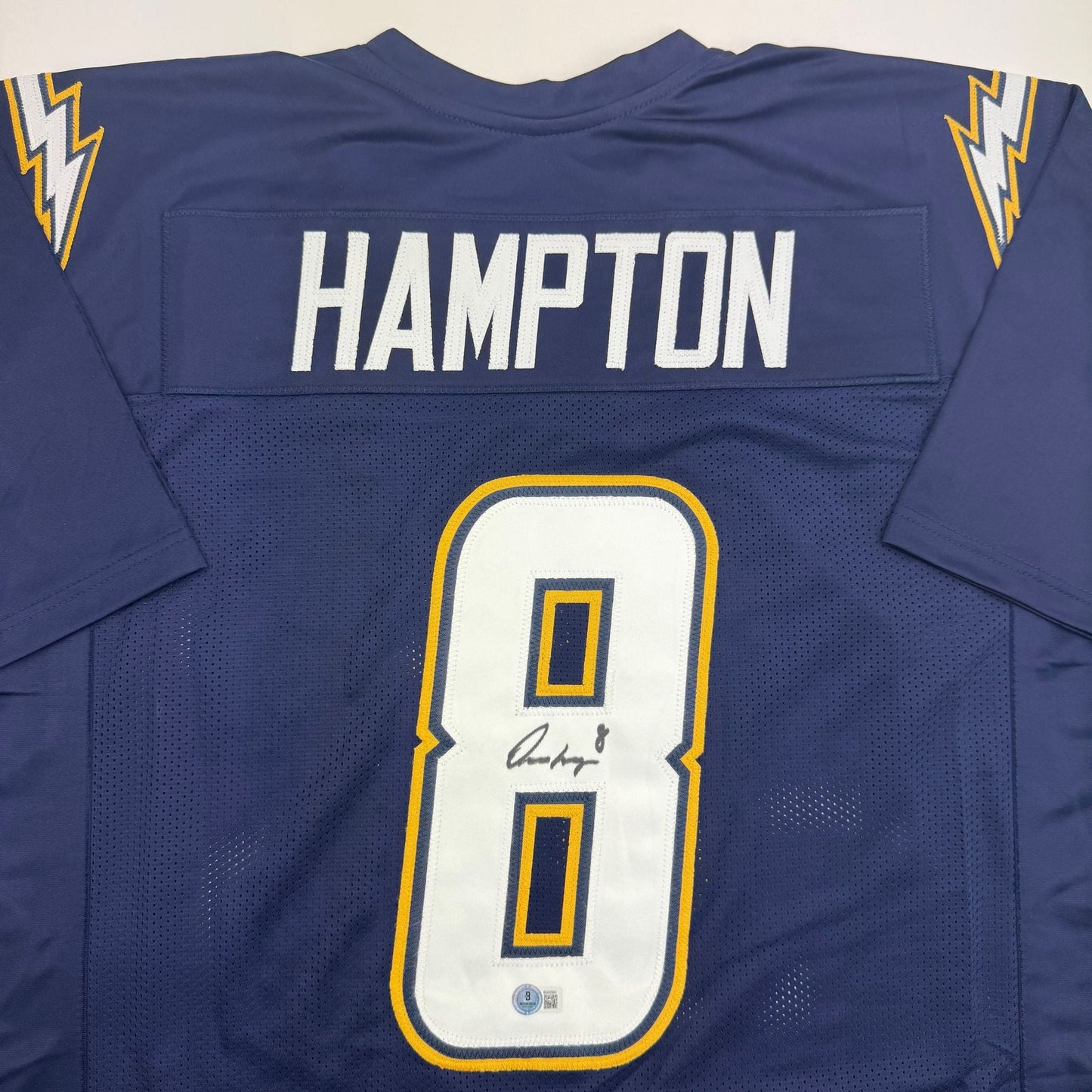 Autographed/Signed Omarion Hampton Los Angeles San Diego Dark Blue Football Jersey Beckett BAS COA