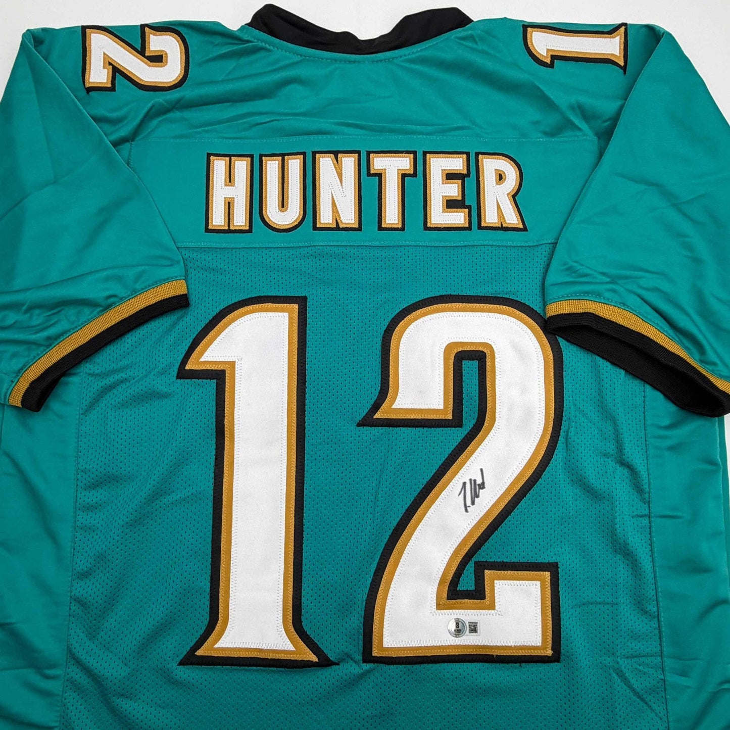 Autographed/Signed Travis Hunter Jacksonville Teal Retro Football Jersey Beckett BAS COA