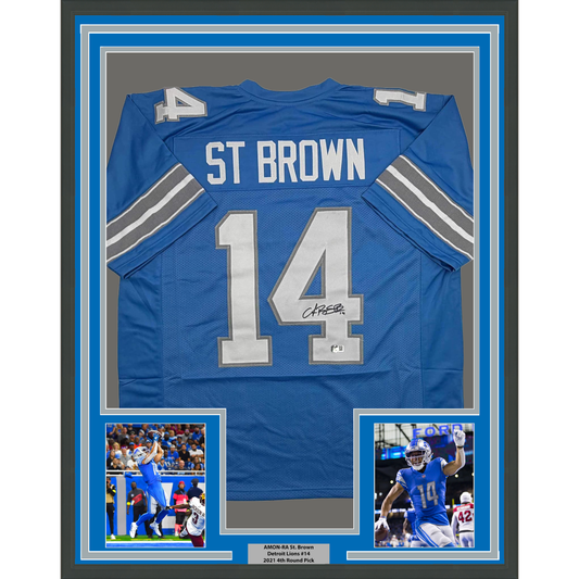 Framed Autographed/Signed Amon-Ra St. Brown 35x39 Detroit Current Blue Football Jersey Beckett BAS COA
