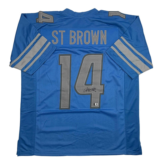 Autographed/Signed Amon-Ra St. Brown Detroit Blue Football Jersey Beckett BAS COA