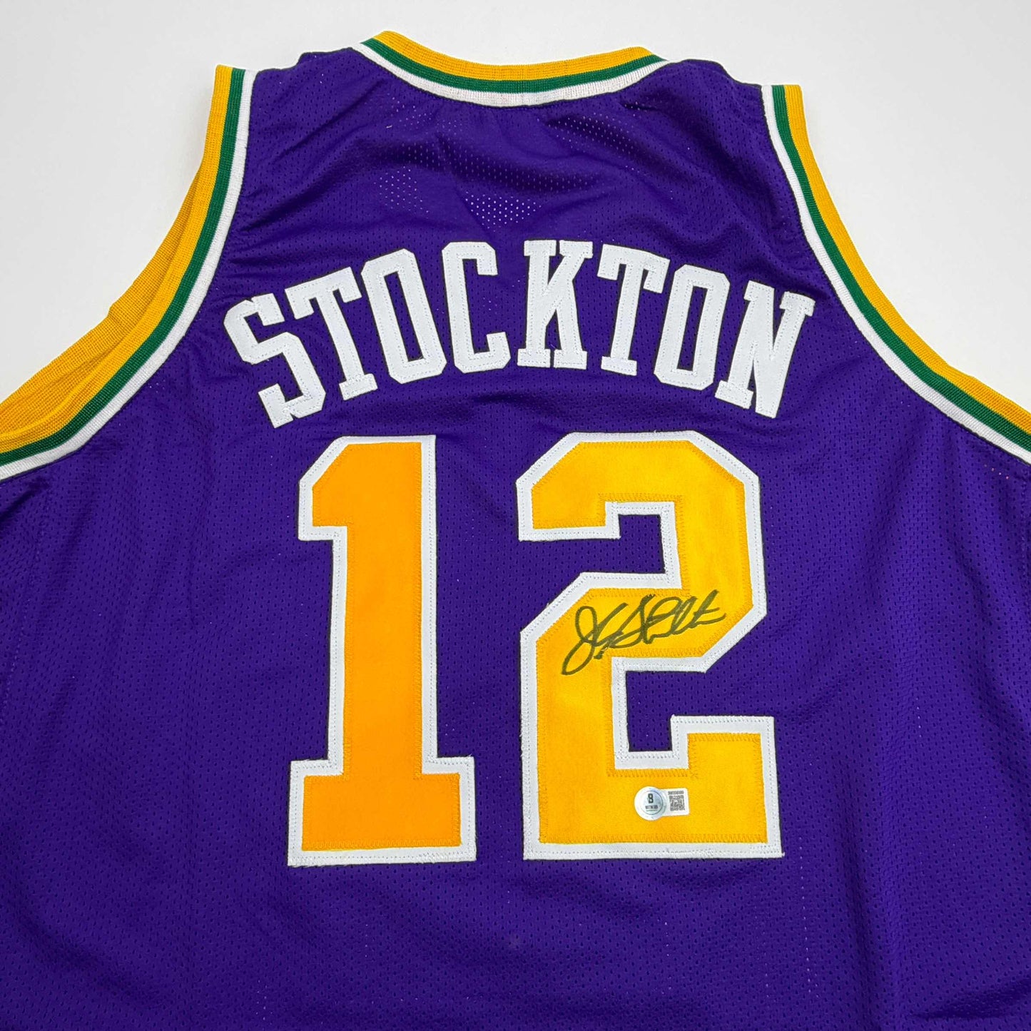 Autographed/Signed John Stockton Utah Purple Basketball Jersey Beckett BAS COA
