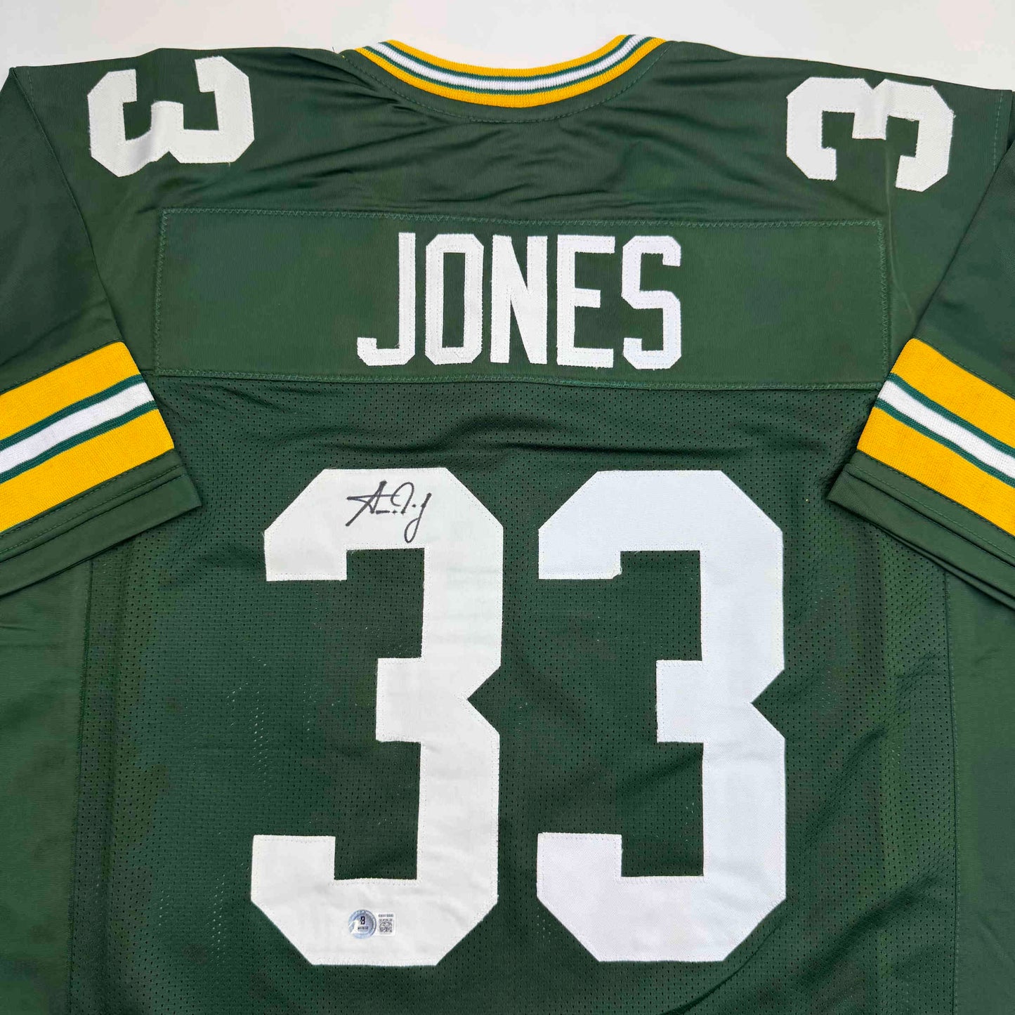 Autographed/Signed Aaron Jones Green Bay Green Football Jersey Beckett BAS COA